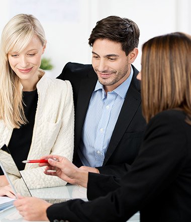 JNR Insurance agent reviewing auto insurance policy with a couple in Brooklyn