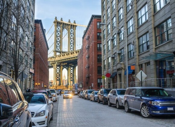 Auto Insurance with cars parked up lined up out side in Dumbo