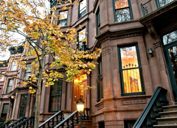 A beautiful house with a gate being sported with renters insurance in dumbo